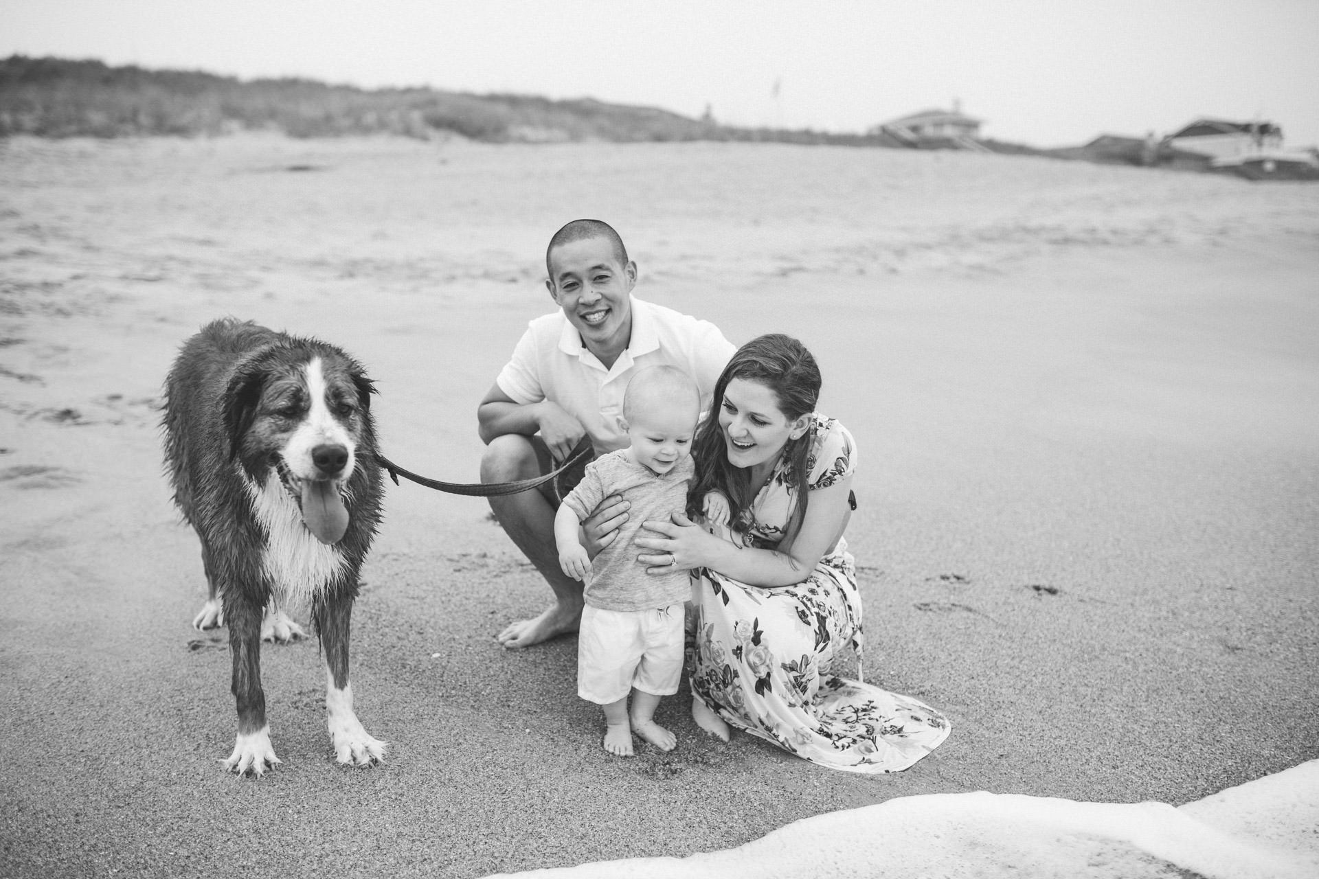 Shannon O'Neil with her husband, son, and dog on an Outer Banks, NC beach