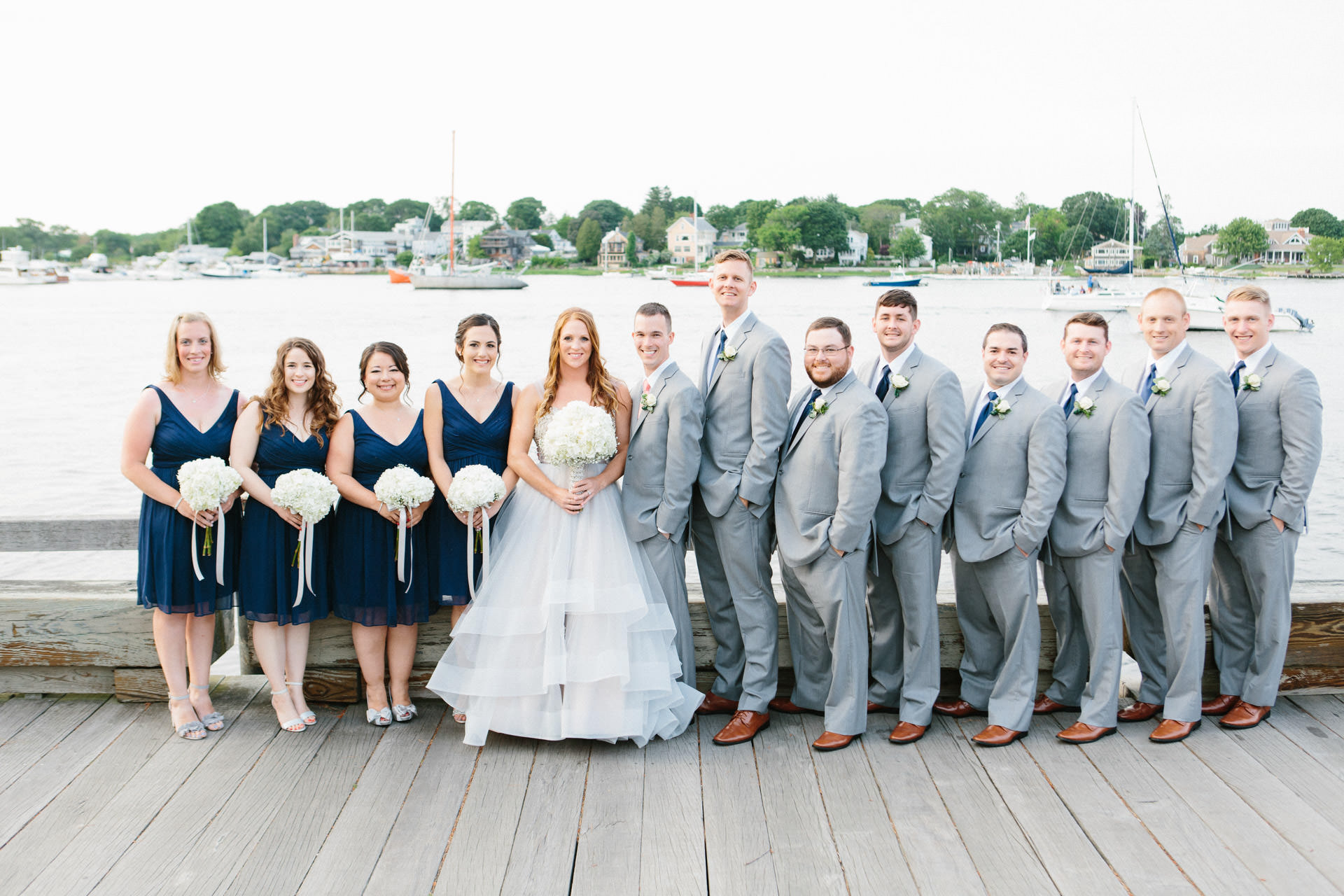 Wedding party posing for a photograph at the Custom House Maritime Museum in Newburyport, MA