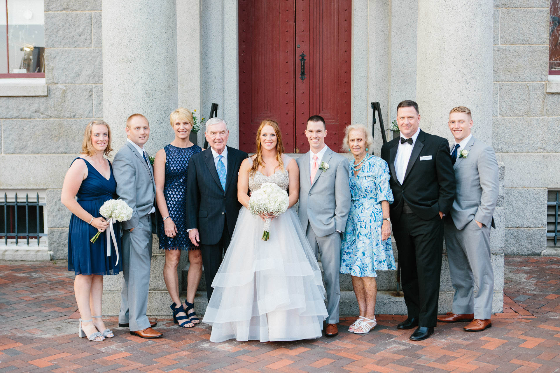 Bride and Groom posing with their immediate family