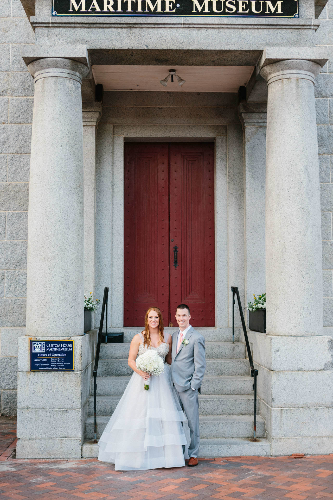 Bride and Groom standing in front of the Custom House Maritime Museum