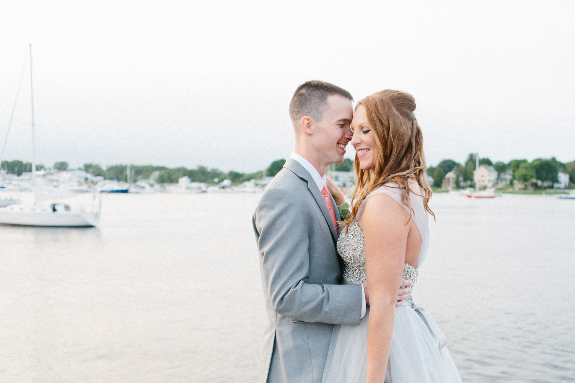Bride and Groom smiling during their wedding at the Custom House Maritime Museum in Newburyport, MA