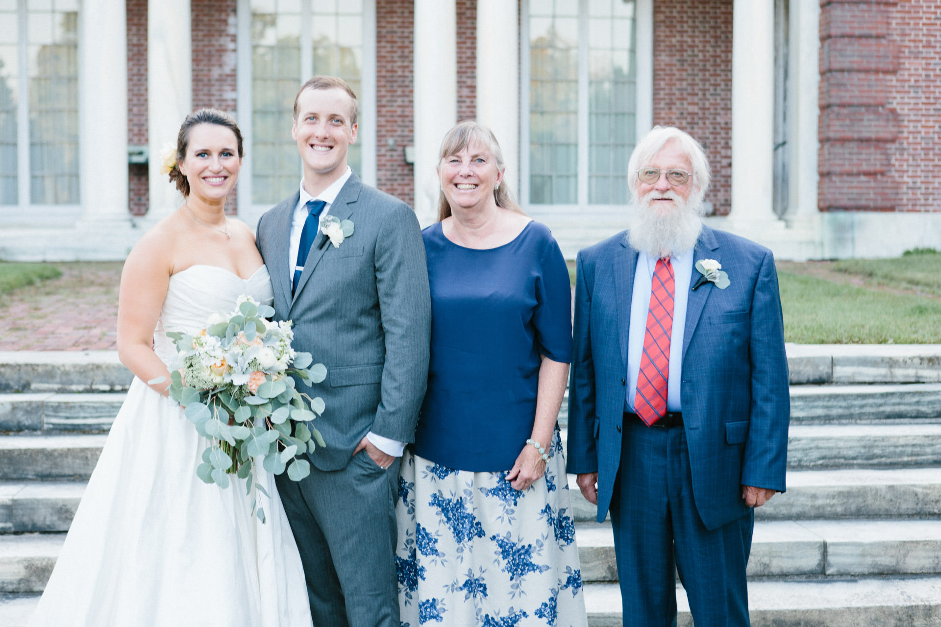 Bride and Groom smiling with their in-laws