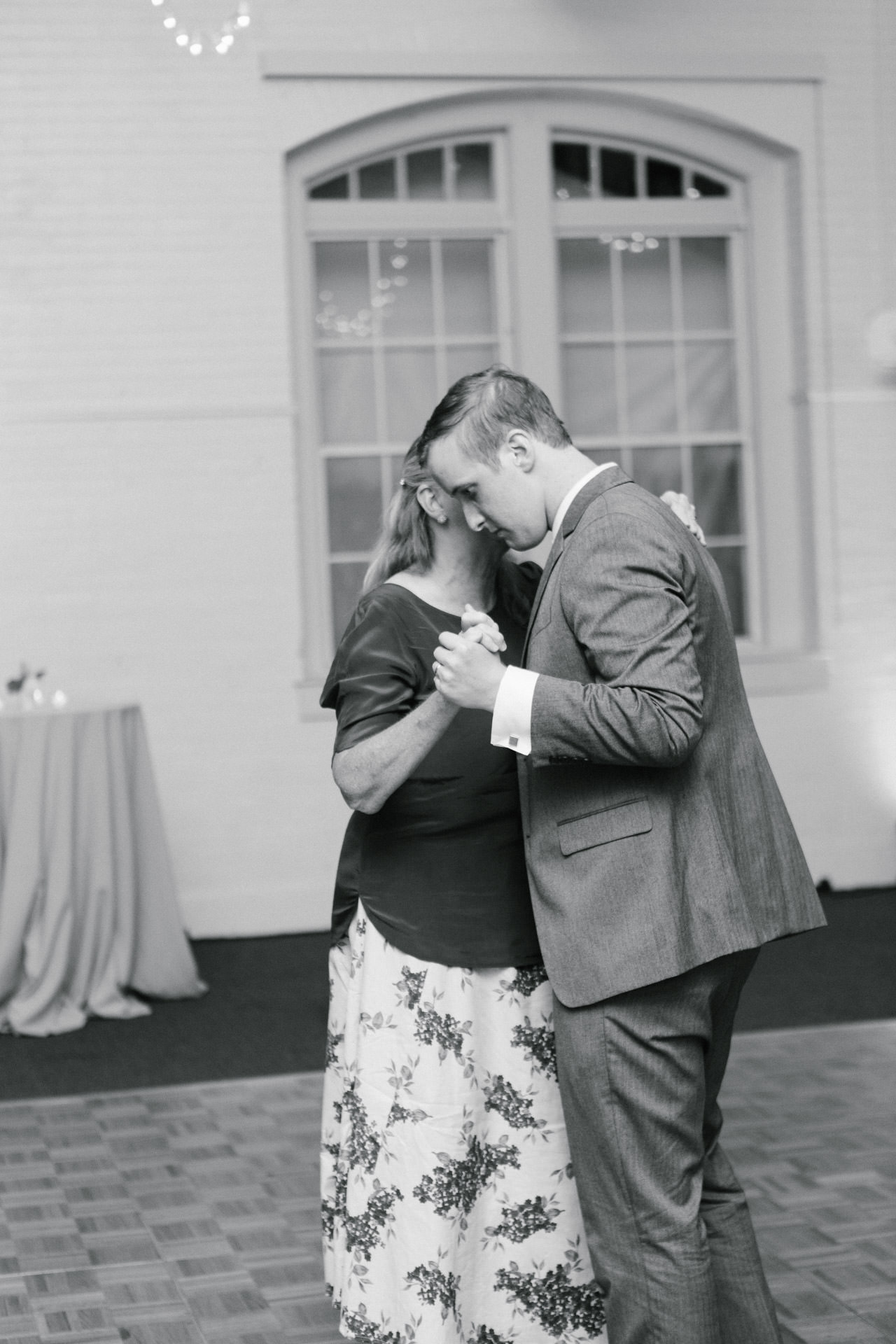 Groom dancing with his mother during the reception