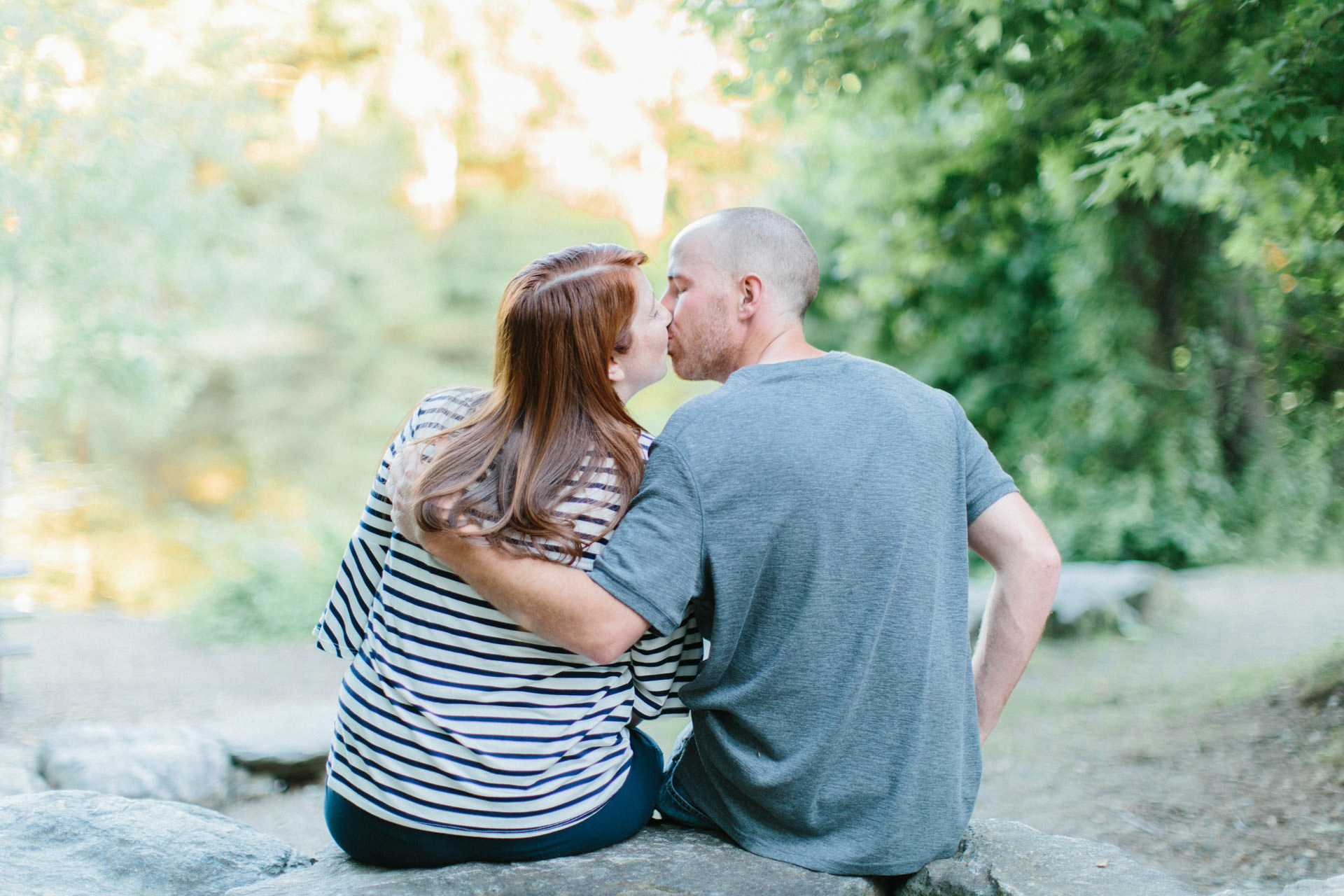 Couple kissing at Great Brook State Park in Carlisle, MA