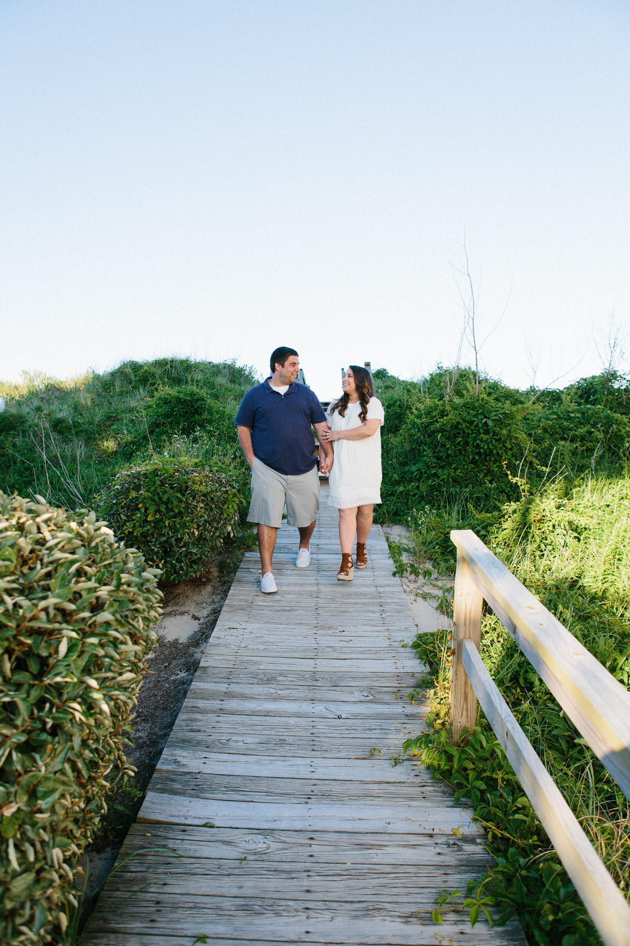 Couple walking during their engagement shoot in the Outer Banks, NC