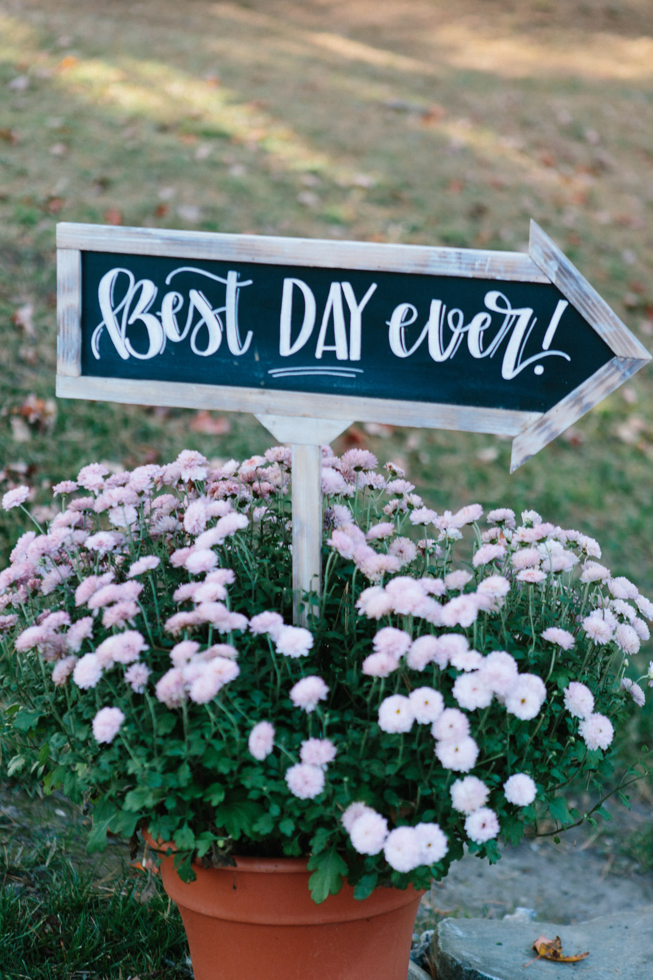 Custom wedding signage in a flower pot
