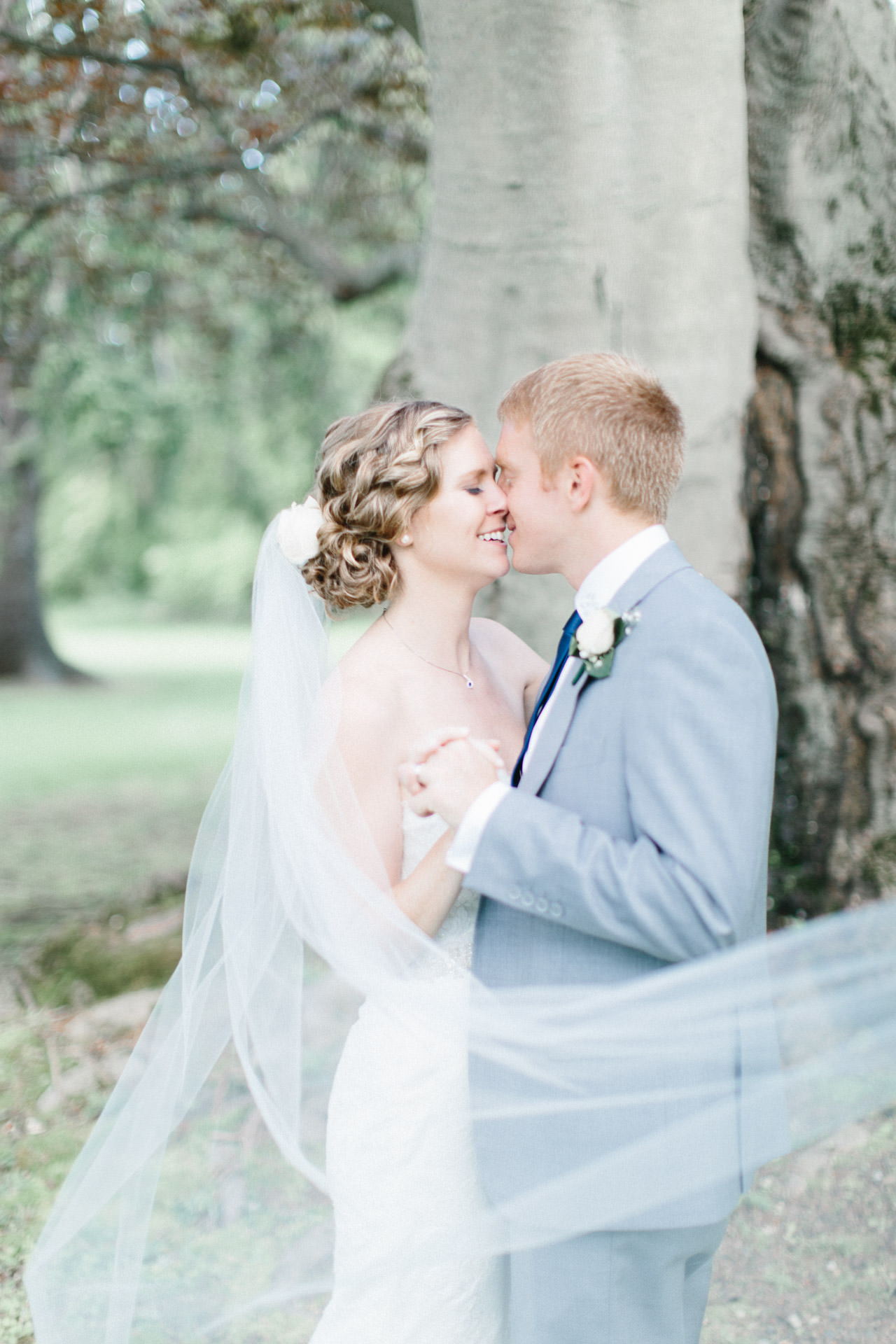 Bride and Groom kissing at Peirce Farm at Witch Hill in Topsfield, MA