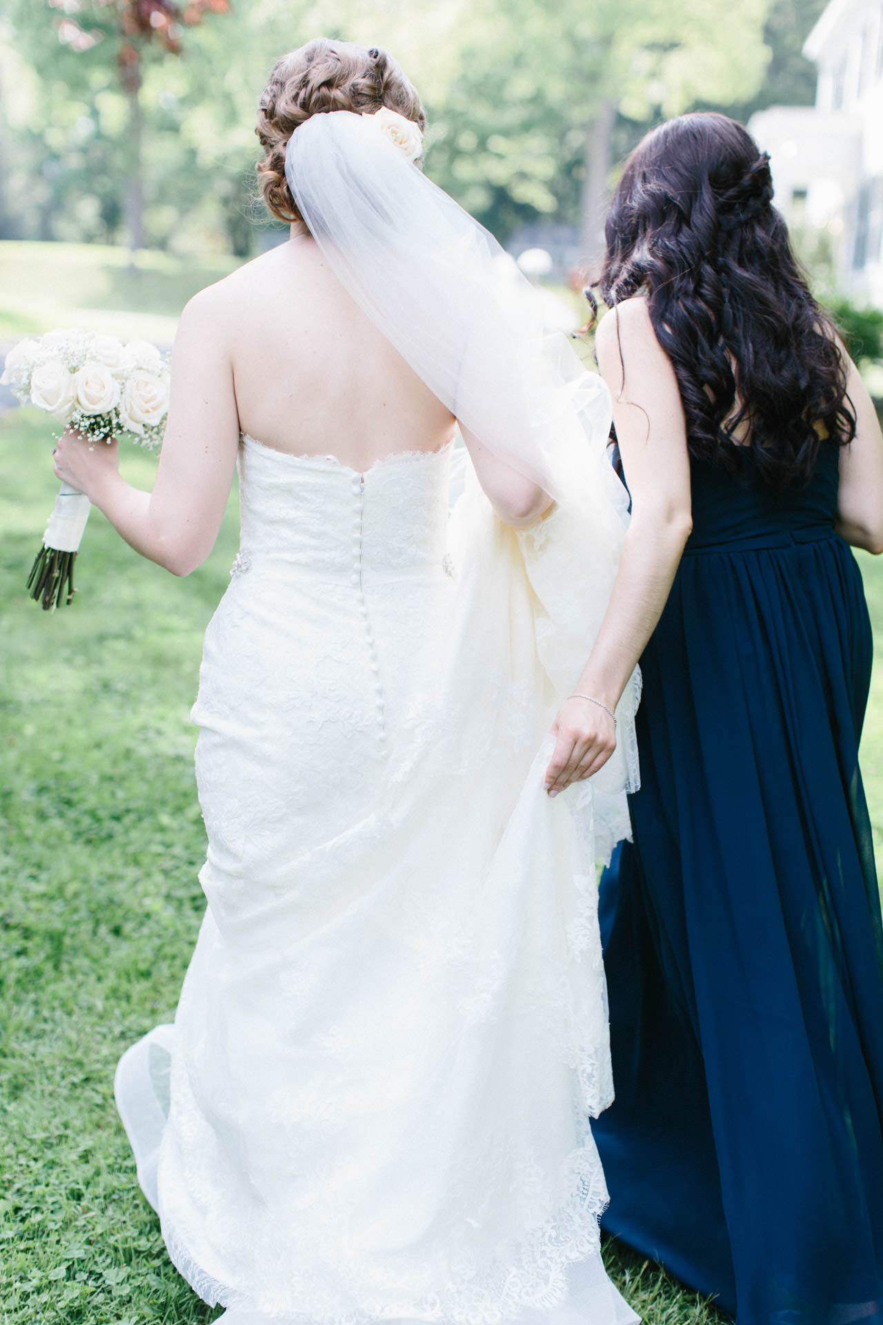 Bride and bridesmaid walking