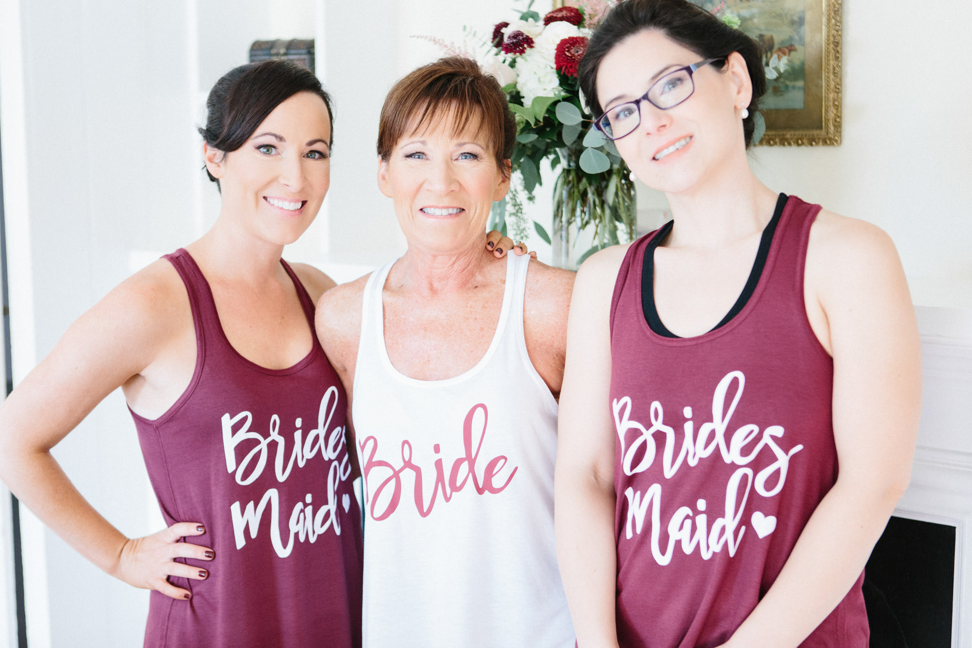 Bride and bridesmaids posing for a photograph