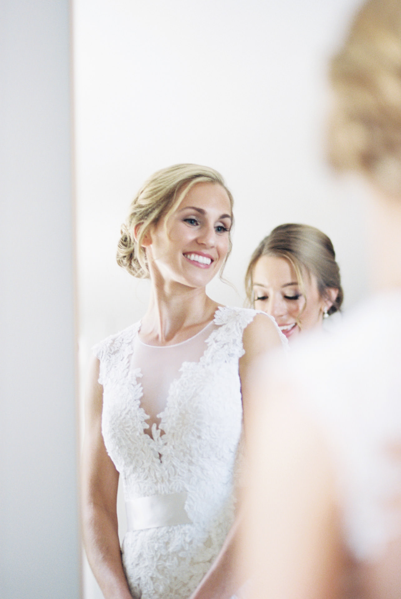 Bride posing for a photograph during her Cape Cod wedding at The Coonamessett Inn in Falmouth, MA