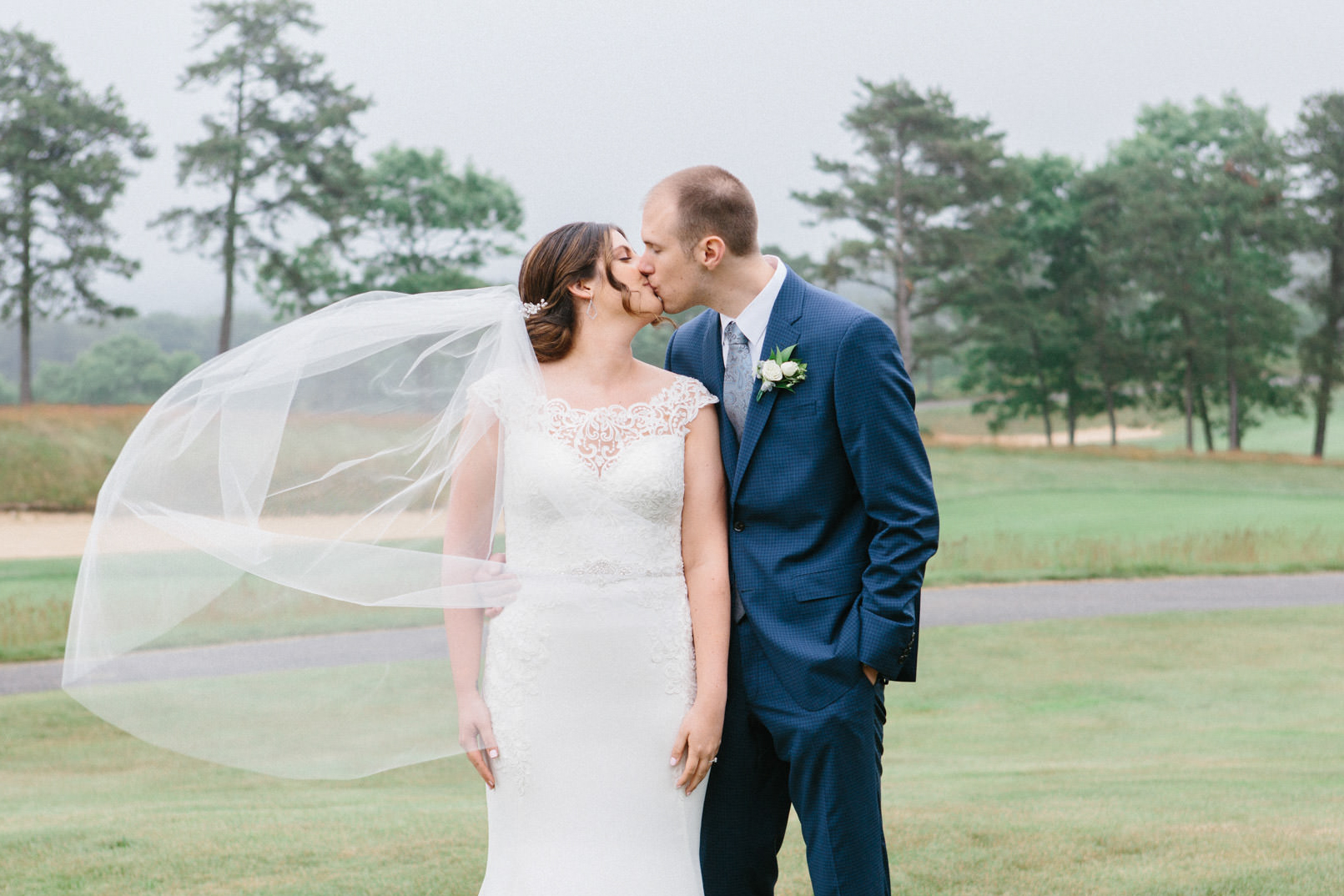 Couple kissing during their wedding at the Waverly Oaks Golf Club in Plymouth, MA