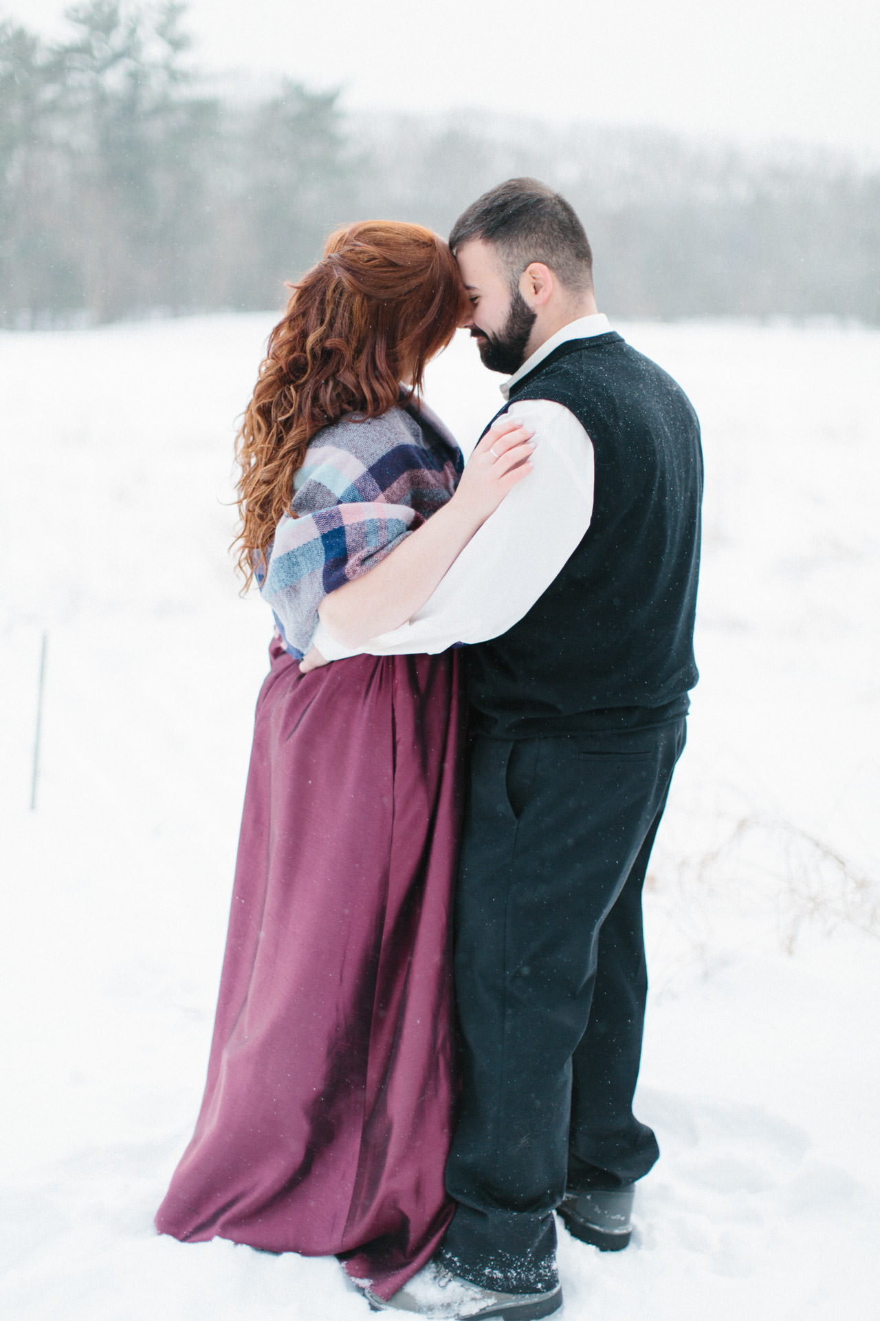 Bride and groom embracing during their elopement at Great Brook Farm State Park in Carlisle, MA