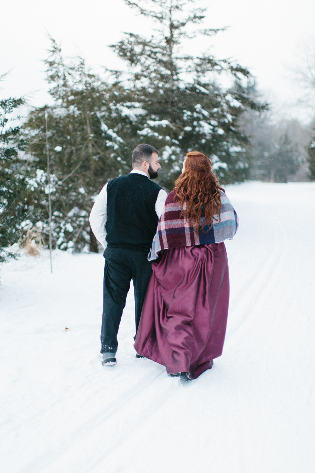 Bride and groom walking in the snow